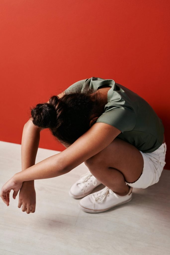 Upset person crouching